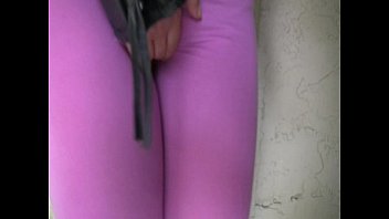 Blond girl pees her spandex leggings outside